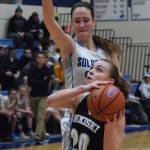Soldotnas Danica Schmidt (top) puts up a block on Nikiskis Bethany Carstens Tuesday night in a nonconference game at Soldotna High School. (Photo by Joey Klecka/Peninsula Carion)