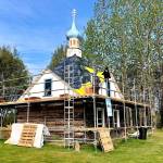 John Wachtel, a former National Parks Service employee, places new cedar shingles on the roof of the Saint Nicholas Memorial Chapel as part of new restorative efforts, on Tuesday, May 21, 2019, in Old Town Kenai, Alaska. (Photo by Victoria Petersen/Peninsula Clarion)