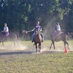 A group of riders engage in a game of polocrosse, a sport combining rules of polo and lacrosse, Thursday, July, 25, 2019 near Soldotna, Alaska. (Photo by Victoria Petersen/Peninsula Clarion)