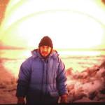 Michael Armstrong stands by Knik Arm in Anchorage shortly after arriving in Alaska in December 1979. The weird glow is caused by taking a photo of a slide illuminated by a desk lamp. (Photo provided by Mark Heffernan)