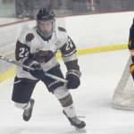 Kenai River Brown Bears forward Peter Morgan and Springfield (Illinois) Jr. Blues defenseman Hunter Mccurdy chase the puck Thursday, Nov. 14, 2019, at the Soldotna Regional Sports Complex. (Photo by Jeff Helminiak/Peninsula Clarion)