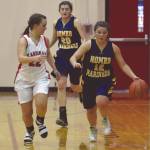 Homers Rylee Doughty dribbles against Kenai Centrals Jaiden Streiff on Friday, Jan. 10, 2019, at Kenai Central High School in Kenai, Alaska. (Photo by Jeff Helminiak/Peninsula Clarion)