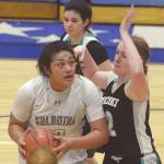 Soldotnas Ituau Tuisaula powers up against Nikiskis Kaycee Bostic on Tuesday, Jan. 21, 2020, at Soldotna High School in Soldotna, Alaska. (Photo by Jeff Helminiak/Peninsula Clarion)