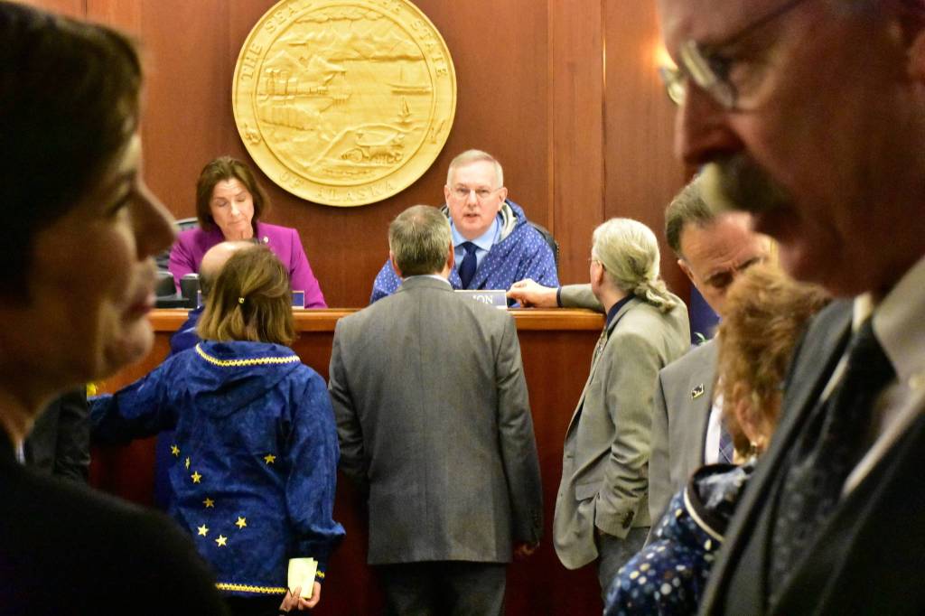 Rep. Ivy Spohnholz, D-Anchorage, left, speaks with Sen. Bert Stedman, R-Sitka, during an at ease in a joint session of the House and Senate on Friday.