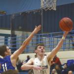 Soldotnas Ray Chumley drives on Palmers Shea Halberg on Saturday, Jan. 25, 2020, at Soldotna High School in Soldotna, Alaska. (Photo by Elizabeth Earl/For the Clarion)