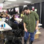 Kenneth Russell and his dog Ichabod, aka Icky, attend the 2020 Project Homeless Connect event at the Soldotna Regional Sports Complex in Soldotna, Alaska, on Jan. 29, 2020. (Photo by Brian Mazurek/Peninsula Clarion)