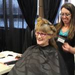 Junetta Delong gets her hair cut during the 2020 Project Homeless Connect event at the Soldotna Regional Sports Complex in Soldotna, Alaska, on Jan. 29, 2020. (Photo by Brian Mazurek/Peninsula Clarion)