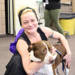 Danielle Bauman and her dog Dozer attend the 2020 Project Homeless Connect event at the Soldotna Regional Sports Complex in Soldotna, Alaska, on Jan. 29, 2020. (Photo by Brian Mazurek/Peninsula Clarion)