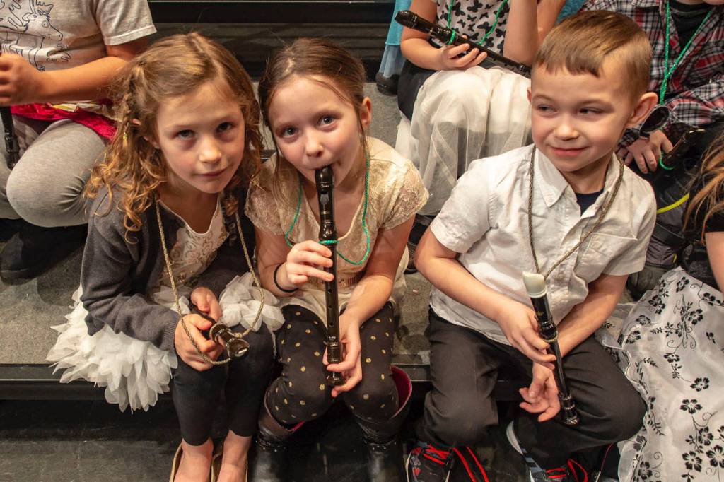 Teagen Kobylarz, Mia Hannevold and Carson Cobb from Soldotna Elementary School play their recorders during Link Up: The Orchestra Rocks! at Kenai Central High School in Kenai, Alaska on Jan. 21, 2017. (Photo courtesy Sue Biggs/Kenai Peninsula Orchestra)