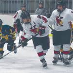 Kenais Nate Beiser, in front of teammate Miles Marston, keeps the puck from William Tomeo of Tri-Valley on Friday at the Kenai Multi-Purpose Facility in Kenai. (Photo by Jeff Helminiak/Peninsula Clarion)