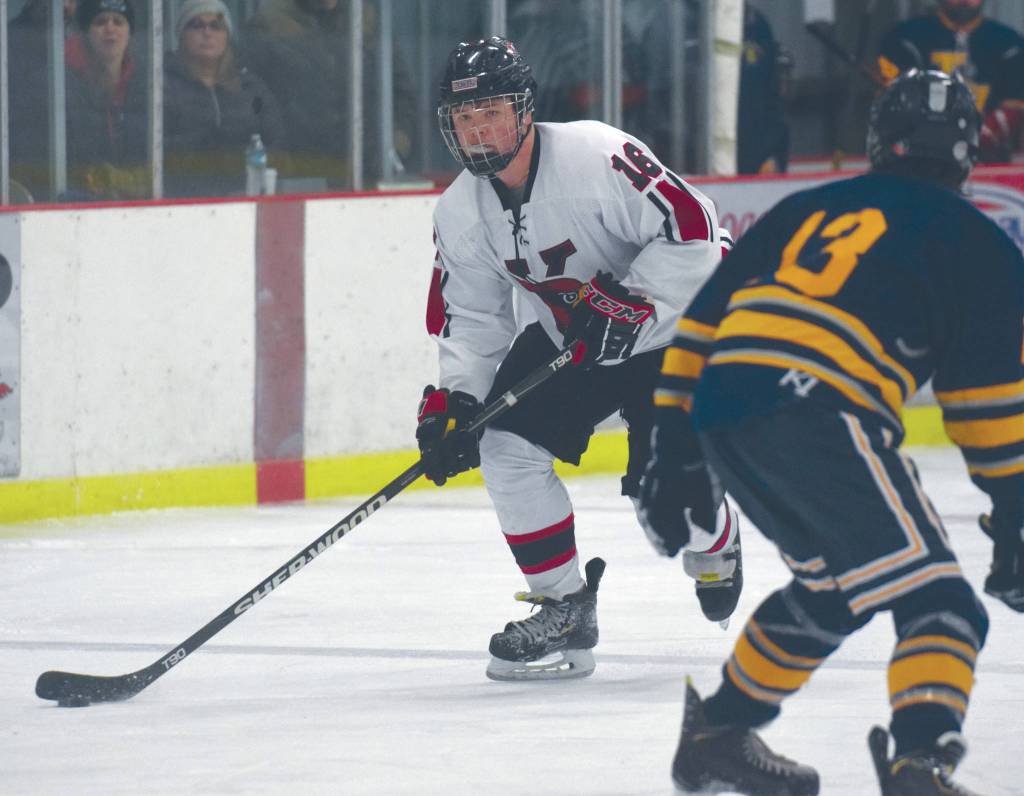 Kenais Logan Dosko prepares to score a second-period goal against Tri-Valley on Friday at the Kenai Multi-Purpose Facility in Kenai. (Photo by Jeff Helminiak/Peninsula Clarion)