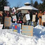 Photo by Delcenia Cosman                                Friends of Anesha Duffy Murnane and members of the community supporting the campaign to bring her home pose with signs during a candlelight vigil held at WKFL Park in Homer, Alaska on Feb. 1.