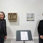 Margo Klass, left, stands next to her box construction, Evocations, while Mary Bee Kaufman, right, stands next to her painting, The Clouds That Roared on Feb. 4, 2020, at the Pratt Museum in Homer, Alaska. Both pieces were created in response to composer Christian Dubeaus Savage. Although the artists created their pieces independently, they wound up sharing common images, such as the long vertical lines at top and the shorter vertical lines at bottom. Their work is part of Denali Artists Respond to Music Inspired by Wilderness, a collaboration between artists and composers showing Feb. 7-May. 25, 2020, at the Pratt Museum in Homer, Alaska. (Photo by Michael Armstrong/Homer News)                                Margo Klass, left, stands next to her box construction, Evocations, while Mary Bee Kaufman, right, stands next to her painting, The Clouds That Roared on Feb. 4, 2020, at the Pratt Museum in Homer, Alaska. Both pieces were created in response to composer Christian Dubeaus Savage. Although the artists created their pieces independently, they wound up sharing common images, such as the long vertical lines at top and the shorter vertical lines at bottom. Their work is part of Denali Artists Respond to Music Inspired by Wilderness, a collaboration between artists and composers showing Feb. 7-May 25 at the Pratt. (Photo by Michael Armstrong/Homer News)