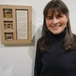 Susan Campbell stands next to her box construction and poem, Listen on Feb. 4, 2020, at the Pratt Museum in Homer, Alaska. It was created in response to composer Jennifer Wrights From the Darkness We Sing the Mighty Land into Being. Her work is part of Denali Artists Respond to Music Inspired by Wilderness, a collaboration between artists and composers showing Feb. 7-May. 25, 2020, at the Pratt Museum in Homer, Alaska. (Photo by Michael Armstrong/Homer News)