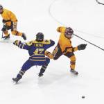 Dimonds Tyler Christiansen skates around Homers Toby Nevak during a Friday, Feb. 14, 2020 game at the 2020 ASAA First National Cup Division I Hockey State Championship at the Curtis D. Menard Memorial Sports Center in Wasilla, Alaska. (Photo by Megan Pacer/Homer News)