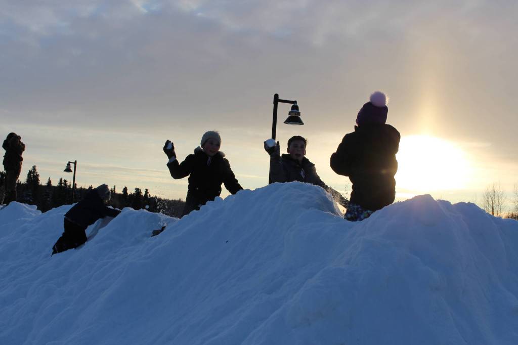 Natalie Stewart, Brooklyn Stewart and Camryn Mcgee engage in a snowball fight during the 2020 Frozen RiverFest at Soldotna Creek Park in Soldotna, Alaska on Feb. 15, 2020. (Photo by Brian Mazurek/Peninsula Clarion)