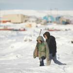 Gregory Bull / Associated Press file                                George Chakuchin (left) and Mick Chakuchin walk on ice over the Bering Sea in Toksook Bay, on Jan. 18. Motor vehicle offices across the U.S. have experienced high demand as an Oct. 1 deadline approaches for Real IDs, special licenses many will need to board domestic flights and enter military bases and some federal buildings, but in remote parts of the country, like rural Alaska, those ID cards may be harder to get. People in Toksook Bay rely on small planes to travel off the island. The near DMV office is 115 miles away in Bethel.
