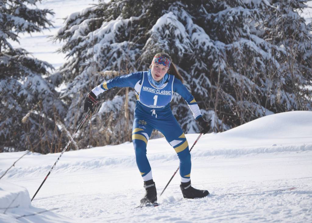 Homers Autumn Daigle climbs a hill at the Kenai Peninsula Borough Nordic ski championships Saturday, Feb. 15, 2020, at Tsalteshi Trails just outside of Soldotna, Alaska. (Photo by Jeff Helminiak/Peninsula Clarion)