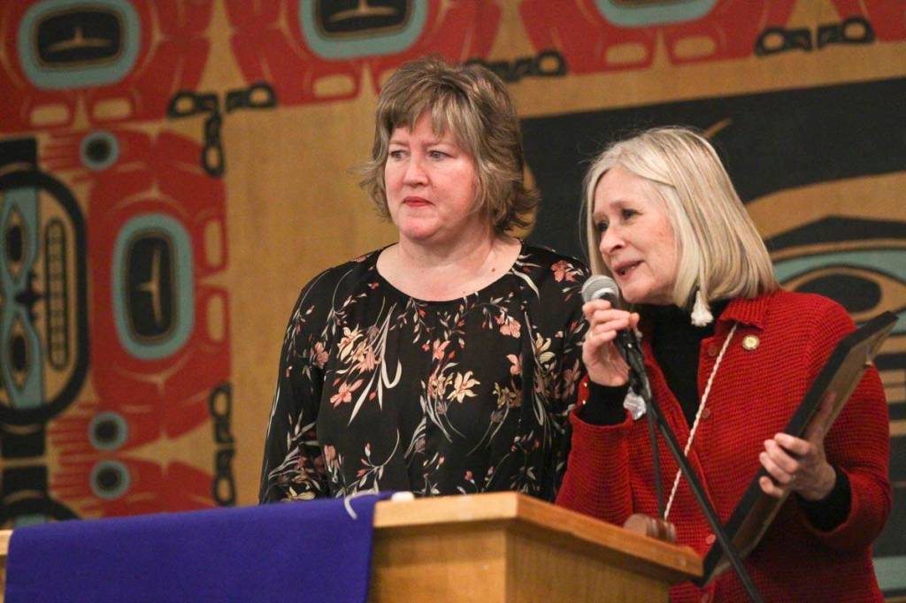 Rep. Sara Hannan and Rep. Andi Story address the crowd during the Elizabeth Peratrovich Day celebration at the Tlingit and Haida Community Council Sunday. (Michael S. Lockett | Juneau Empire)