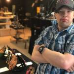 Victoria Petersen / Peninsula Clarion                                 Ethan Satterwhite stands near a clay mask he created in an art class at Hope Community Resources in Soldotna.