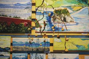 A collection of Deborah Poores paintings at Grace Ridge Brewery on Friday, Feb. 7, 2020, in Homer, Alaska. Its an interesting hanging space there, she said of the display area at the brewery. Youre really presenting those pieces as a collage. You have to squish them together. (Photo by Michael Armstrong/Homer News)