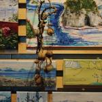 A collection of Deborah Poores paintings at Grace Ridge Brewery on Friday, Feb. 7, 2020, in Homer, Alaska. Its an interesting hanging space there, she said of the display area at the brewery. Youre really presenting those pieces as a collage. You have to squish them together. (Photo by Michael Armstrong/Homer News)