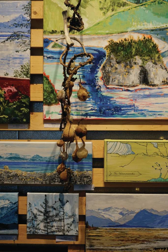 A collection of Deborah Poores paintings at Grace Ridge Brewery on Friday, Feb. 7, 2020, in Homer, Alaska. Its an interesting hanging space there, she said of the display area at the brewery. Youre really presenting those pieces as a collage. You have to squish them together. (Photo by Michael Armstrong/Homer News)
