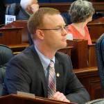 Alaska Rep. David Eastman sits at his desk on the Alaska House floor on Thursday, March 5, 2020, in Juneau, Alaska. The House voted Thursday to remove Eastman, a Wasilla Republican, from committee positions after House Minority Leader Lance Pruitt indicated frustrations with Eastman within the GOP caucus. (AP Photo/Becky Bohrer)