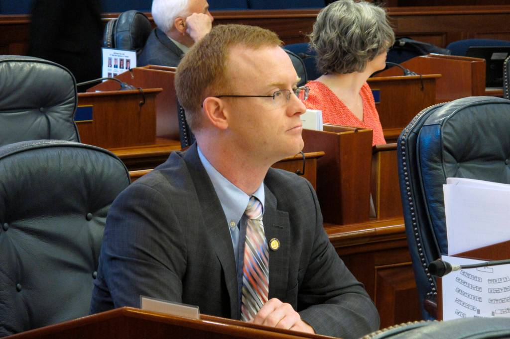 Alaska Rep. David Eastman sits at his desk on the Alaska House floor on Thursday, March 5, 2020, in Juneau, Alaska. The House voted Thursday to remove Eastman, a Wasilla Republican, from committee positions after House Minority Leader Lance Pruitt indicated frustrations with Eastman within the GOP caucus. (AP Photo/Becky Bohrer)