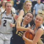 Lumen Christis Kaiya Thornsness and Nikolaevsks Kerianna Lasiter battle for the ball Thursday, March 5, 2020, at the Peninsula Conference basketball tournament at Cook Inlet Academy in Soldotna, Alaska. (Photo by Jeff Helminiak/Peninsula Clarion)