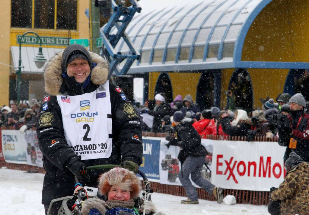 Musher Martin Massicotte of St-Tite, Quebec, Canada, leaves the start line during the ceremonial start of the Iditarod Trail Sled Dog Race Saturday, March 7, 2020, in Anchorage, Alaska. The real race starts March 8 about 50 miles north of Anchorage, with the winner expected in the Bering Sea coastal town of Nome about 10 or 11 days later. (AP Photo/Mark Thiessen)