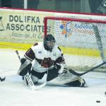 Kenai River goalie Landon Pavlisin defends the net from Amarillo (Texas) Bulls forward Niclas Puikkonen as Kenai Rivers Ryan Reid looks on Friday, March 6, 2020, at the Soldotna Regional Sports Complex in Soldotna, Alaska. (Photo by Jeff Helminiak/Peninsula Clarion)