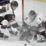 Kenai River Brown Bears forward Max Helgeson and goalie Landon Pavlisin keep the Fairbanks Ice Dogs from scoring Friday, Nov. 22, 2019, at the Soldotna Regional Sports Complex in Soldotna, Alaska. (Photo by Jeff Helminiak/Peninsula Clarion)