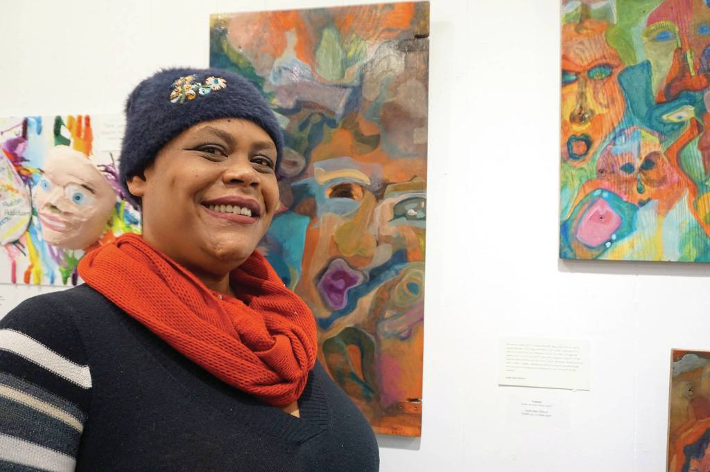 Sadie Mae Millard stands by her art on March 6, 2020, at the Disability Art Show at the Homer Council on the Arts in Homer, Alaska. (Photo by Michael Armstrong/Homer News)