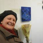 Cindy Nelson stands by her art on March 6, 2020, at the Disability Art Show at the Homer Council on the Arts in Homer, Alaska. (Photo by Michael Armstrong/Homer News)