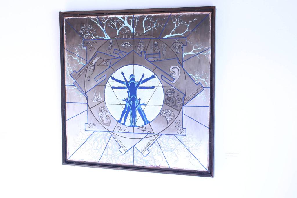 A piece made from acrylic paint, cardboard and reclaimed wood by local artist Charlotte Coots entitled Is this the Blue Print for Us? is seen here on display at the Kenai Fine Art Center in Kenai, Alaska on March 18, 2020. (Photo by Brian Mazurek/Peninsula Clarion)