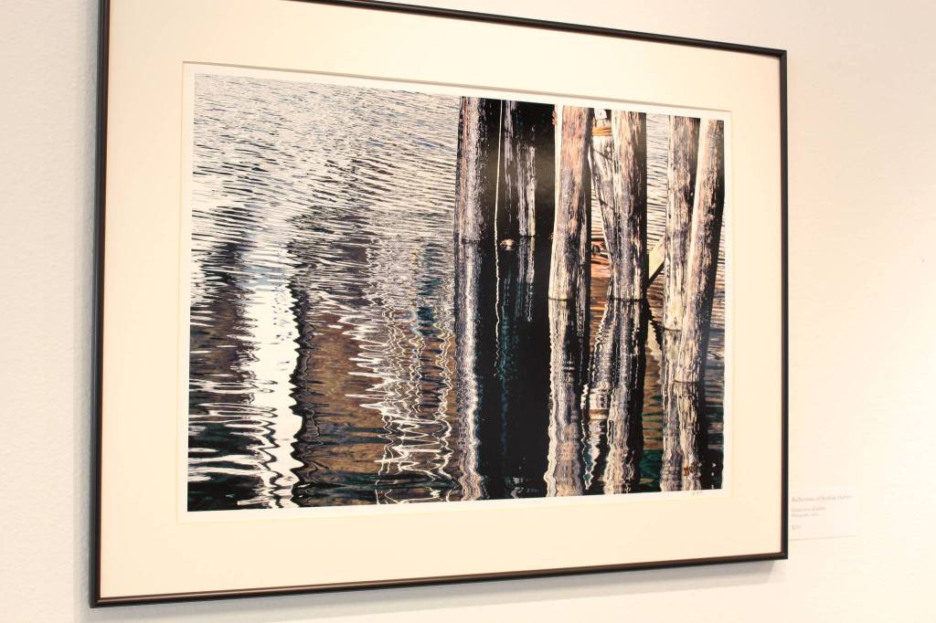 Reflections of Kodiak Harbor, a piece by local photographer Genevieve Klebba, is seen here on display at the Kenai Fine Art Center in Kenai, Alaska on March 18, 2020. (Photo by Brian Mazurek/Peninsula Clarion)
