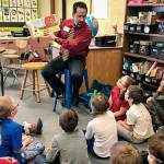 Superintendent John OBrien reads to students at Mountain View Elementary. (Photo courtesy of the Kenai Peninsula Borough School District Communications Blog/Pegge Erkeneff)