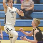 Soldotnas Jersey Truesdell drives the lane on Lathrops Ben Krastra on Friday, Feb. 7, 2020, at Soldotna High School in Soldotna, Alaska. (Photo by Jeff Helminiak/Peninsula Clarion)