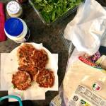 Use whats in your kitchen to whip up delicious, creative meals. Salmon, greens, an assortment of spices and condiments can be used to make patties that will go inside a wrap or a pasta bowl. (Photo by Victoria Petersen/Peninsula Clarion)