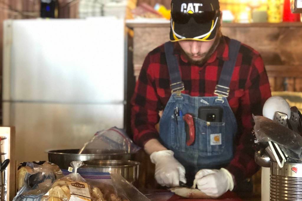 Austin Hobaugh, a chef at Set Free Alaska in Kenai, prepares meals for the day in Kenai, Alaska on March 27, 2020. (Courtesy Amy Lynn Burdett Belue)