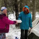 Amy Lynn Burdett Belue, left, delivers a meal to a member of the community experiencing homelessness in this undated photo. (Courtesy Amy Lynn Burdett Belue)