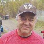 During the 2019 cross-country season, Soldotna High School coach Ted McKenney put on Kenai Central gear to support the Kardinals in the small-schools race before switching back to SoHi gear for the big-schools race. (Photo by Crystal McKenney)