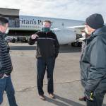 Photo courtesy Office of the Governor                                Gov. Mike Dunleavy (center) speaks with Edward Graham (left) of Samaritans Purse, as two other Samaritans Purse staff members watch. Dunleavy met the crew and staff of the Samaritans Purse DC-8 at Ted Stevens Anchorage International Airport as they offloaded thousands of pounds of medical supplies bound for rural Alaska.
