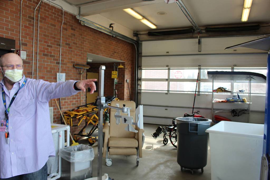 Shayne Pond, director of the emergency department at Central Peninsula Hospital in Soldotna, Alaska, gives a tour of the ambulance bay on April 7, 2020. The ambulance bay has been modified with negative pressure rooms so that COVID-19 samples can be collected and patients can be treated without actually entering the emergency room. (Photo by Brian Mazurek/Peninsula Clarion)