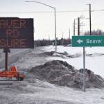 A sign at the intersection of Beaver Loop Road and Kenai Spur Highway tells motorists of impending construction Tuesday, April 7, 2020, in Kenai, Alaska. (Photo by Jeff Helminiak/Peninsula Clarion)