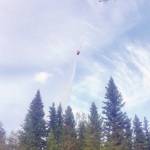 A helicopter performing heli-bucket drops on the Swan Lake Fire in 2019. (Photo by Mike McNulty/Kenai National Wildlife Refuge)