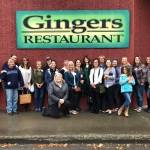 Members of the Soldotna Cash Mob stand outside Gingers Restaurant in Soldotna in September 2019. (Photo courtesy Rhonda McCormick)