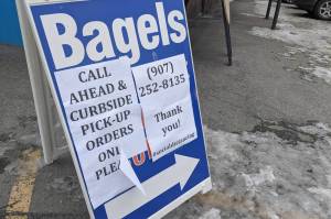 A sign announcing the pick-up only services at Everything Bagels in Soldotna, Alaska, is seen on April 1, 2020. Gov. Mike Dunleavy announced loosened restrictions on dine-in services during a press conference on Tuesday, April 21, 2020. (Photo by Erin Thompson/Peninsula Clarion)