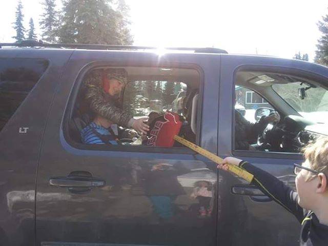 Mason McMilin celebrating his eighth birthday with no-touch high fives and a drive-by birthday in Soldotna, Alaska, on April 10, 2020. (Photo courtesy of Kim McMilin)